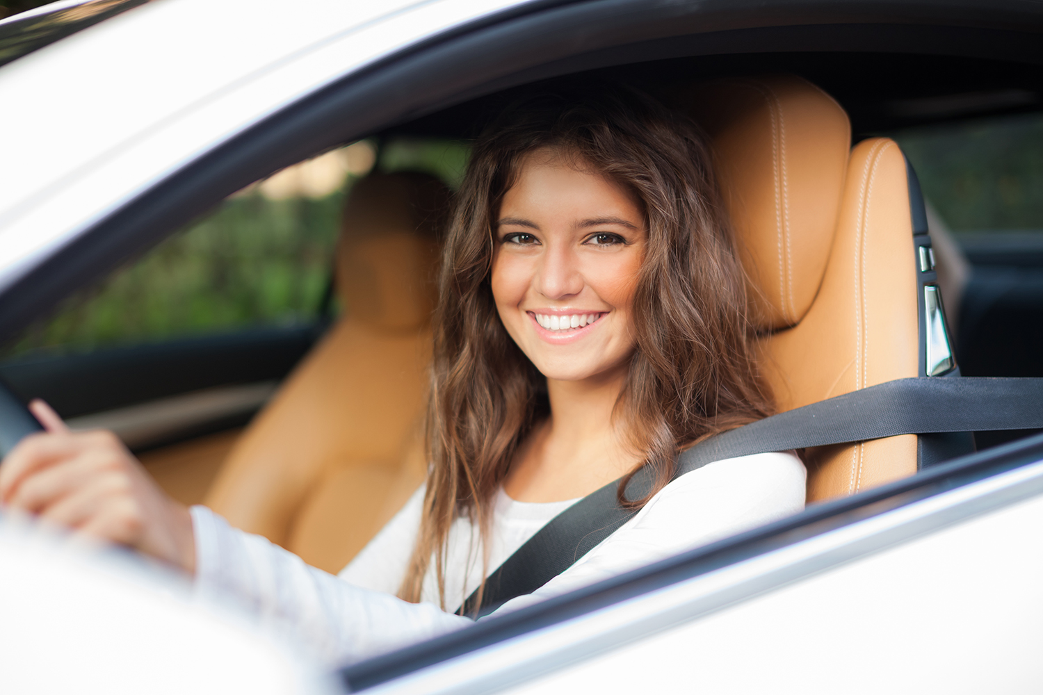 Young woman driving her car